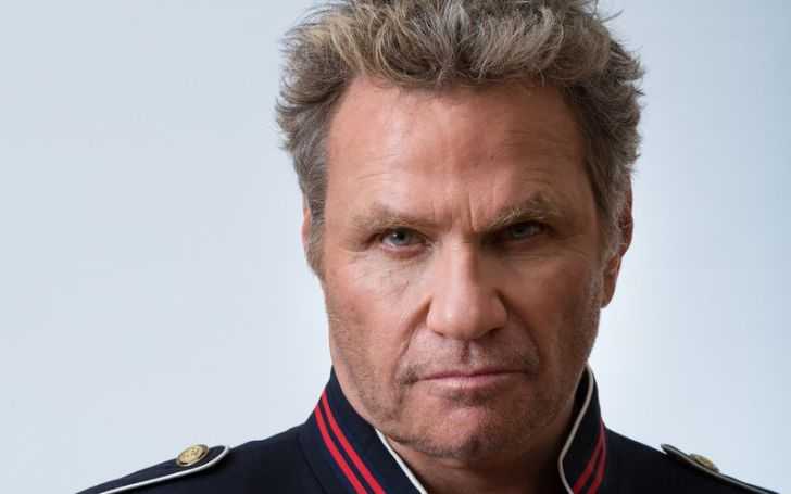 Martin Kove posing for camera.