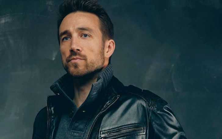 Brendon Zub in a black leather jacket.