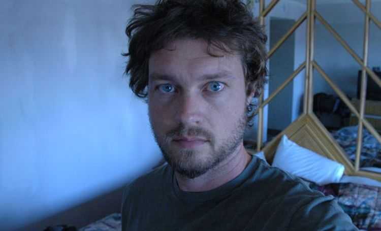 The multi-talented journalist Evan Ratliff clicks a selfie picture.
