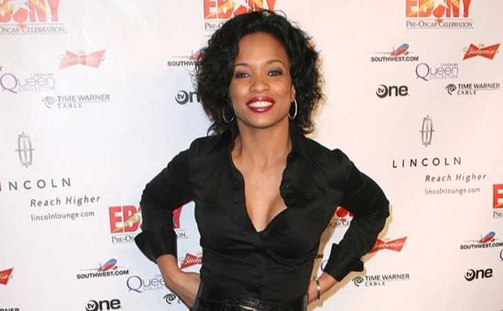 Karrine Steffans in a black top at an event.