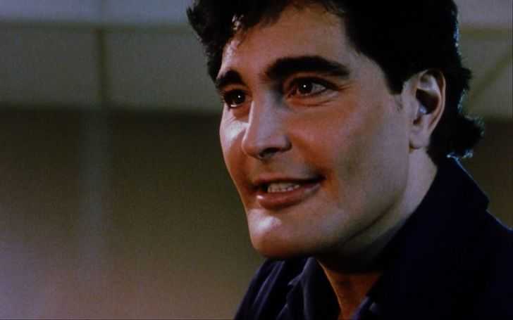 Robert Z'Dar in a black shirt.