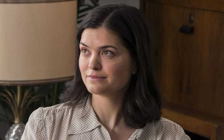 Samantha Colley in a bob cut and a grey top.